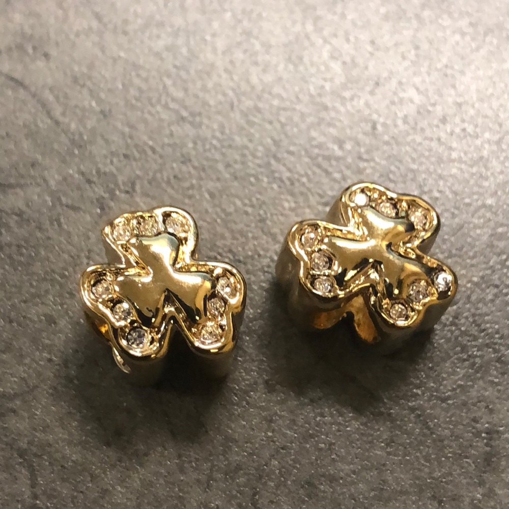 Two golden lucky diamond charms
